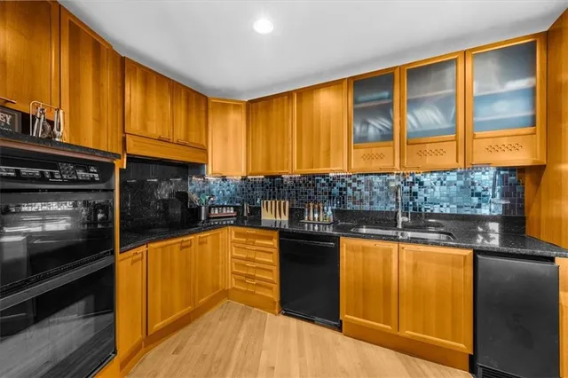 a bedroom with furniture and a large window