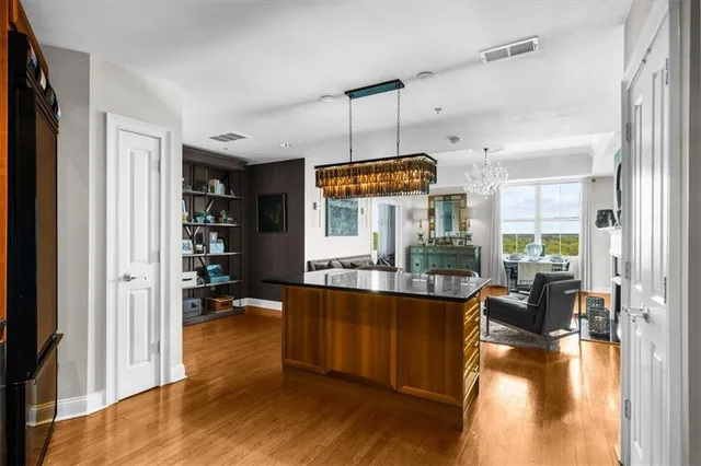a bathroom with a double vanity sink a mirror and a shower