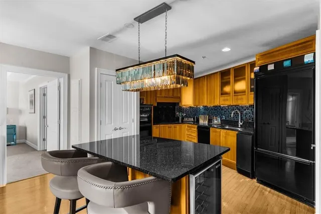 a living room with furniture a fireplace and a large mirror