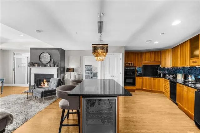a large white bathroom with a double vanity sink a large mirror and a shower