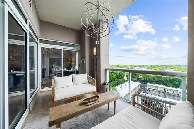 a front view of a building with a garden and plants