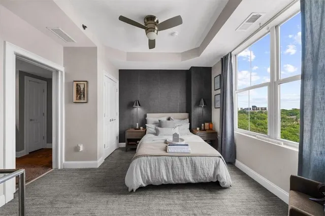 a view of a hallway with living room and furniture