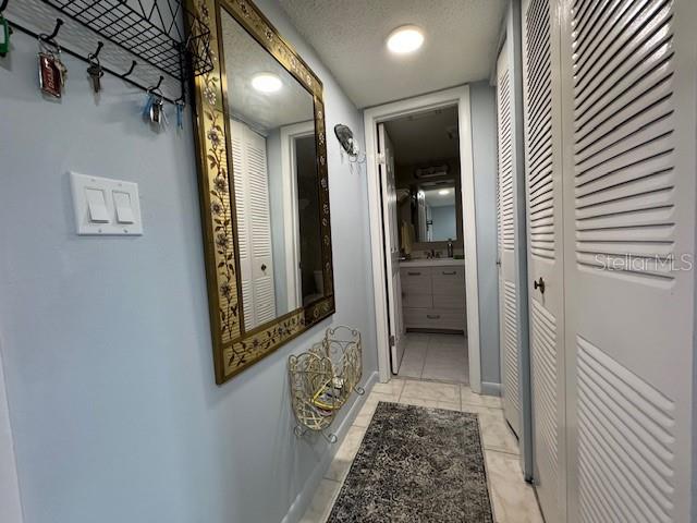 11485 Oakhurst Road, Unit 319 Largo, FL 33774 - Photo 25 of 63 a view of a hallway with wooden floor and closet area