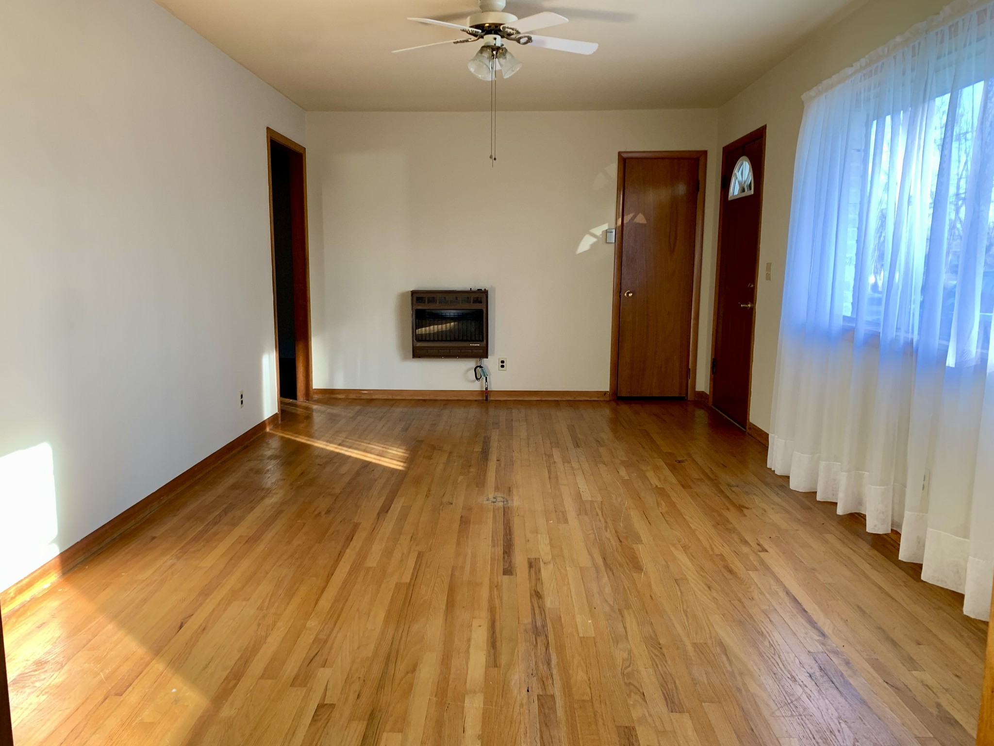 807 Days Road Lafayette, TN 37083 - Photo 7 of 14 a view of an empty room with wooden floor and a window