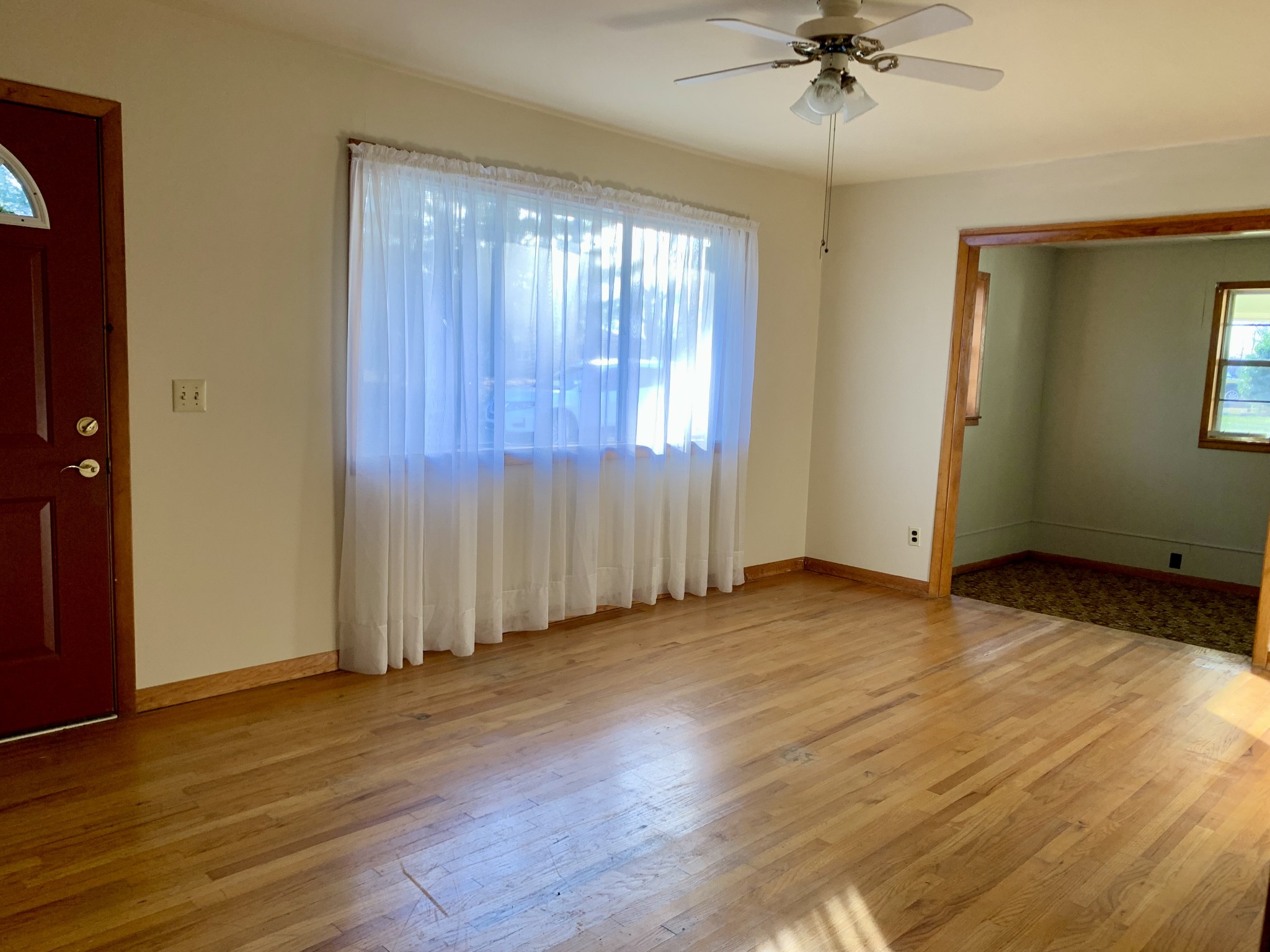 807 Days Road Lafayette, TN 37083 - Photo 8 of 14 a view of an empty room with a window and wooden floor
