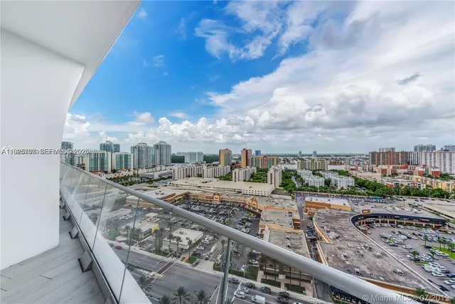 a view of a swimming pool with a yard
