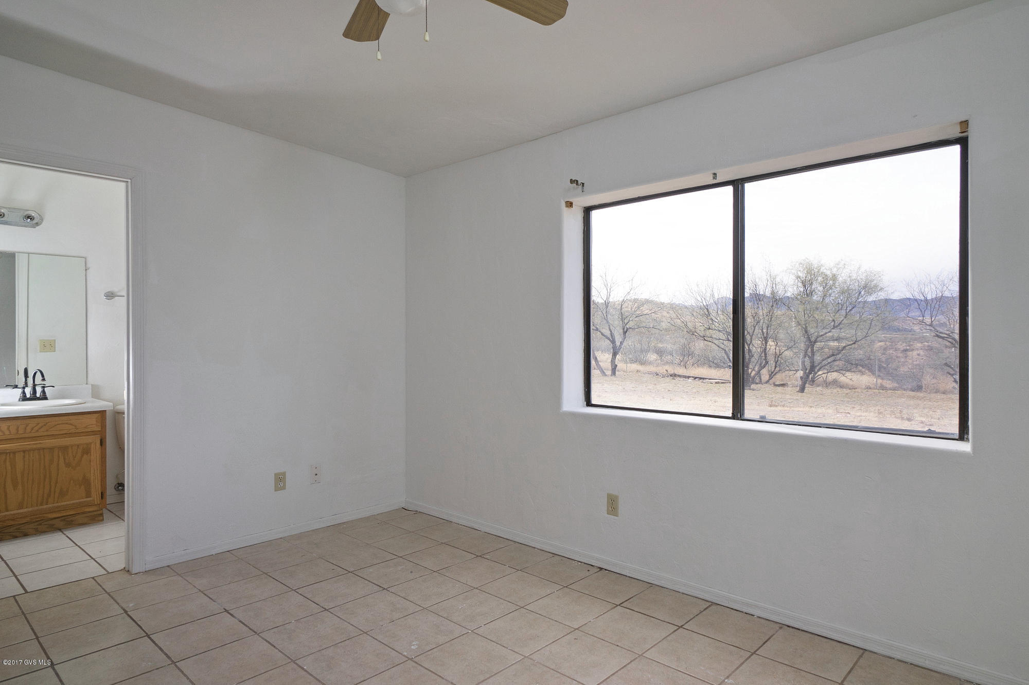 1308 Calle Cherokee Rio Rico, AZ 85648 - Photo 12 of 15 an empty room with windows