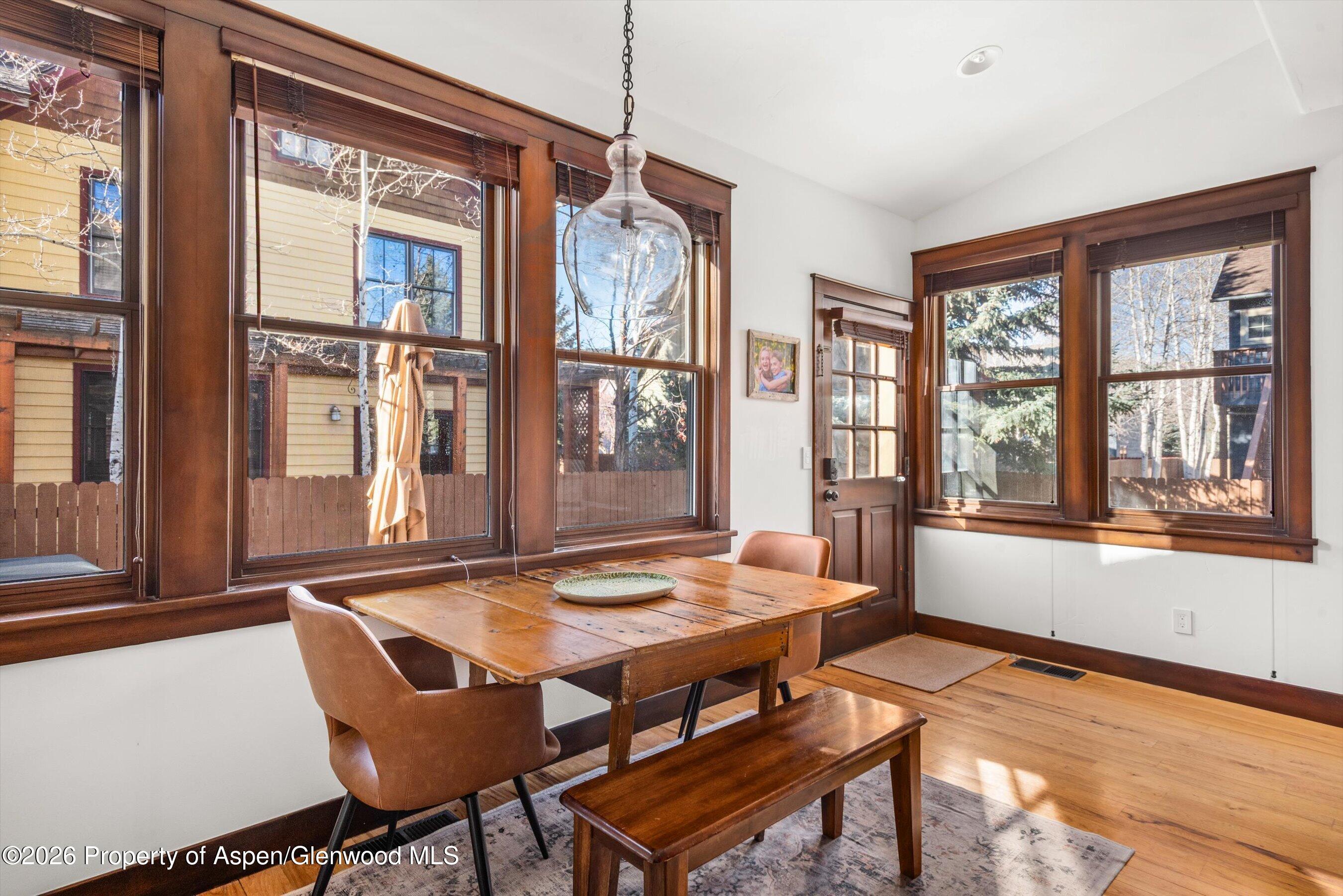 410 Meadow Court Basalt, CO 81621 - Photo 15 of 30 a view of a dining room with furniture large windows and wooden floor
