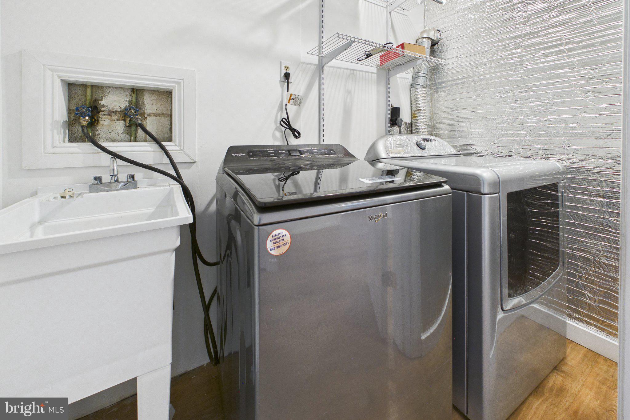 13235 Sturbridge Road Woodbridge, VA 22192 - Photo 31 of 53 Modern laundry space with sleek appliances.