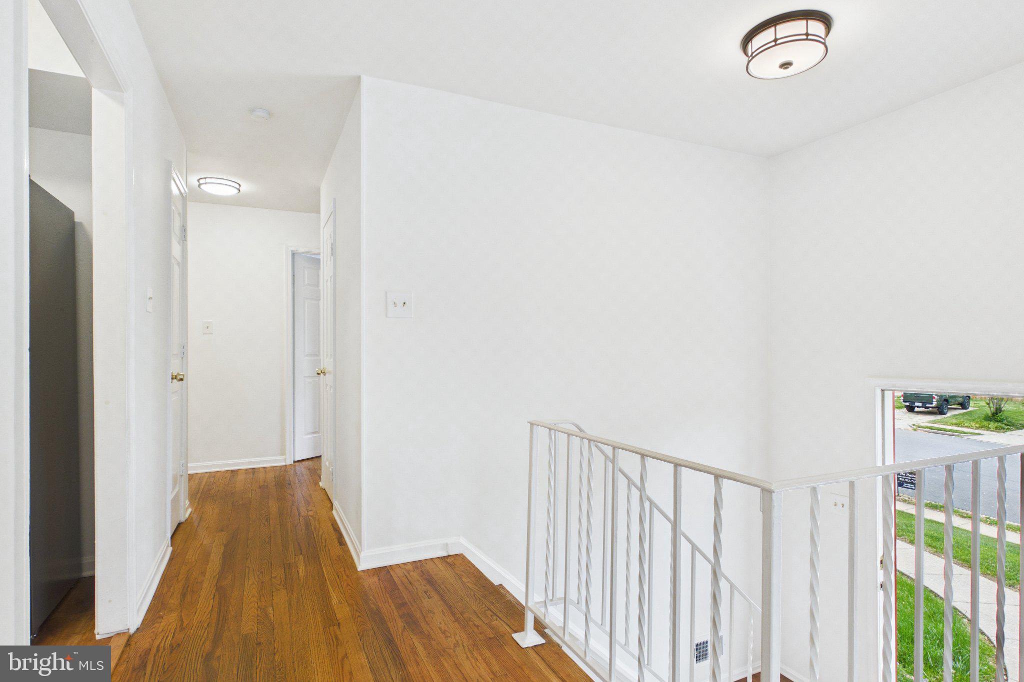 13235 Sturbridge Road Woodbridge, VA 22192 - Photo 43 of 53 Bright and airy hallway retreat.