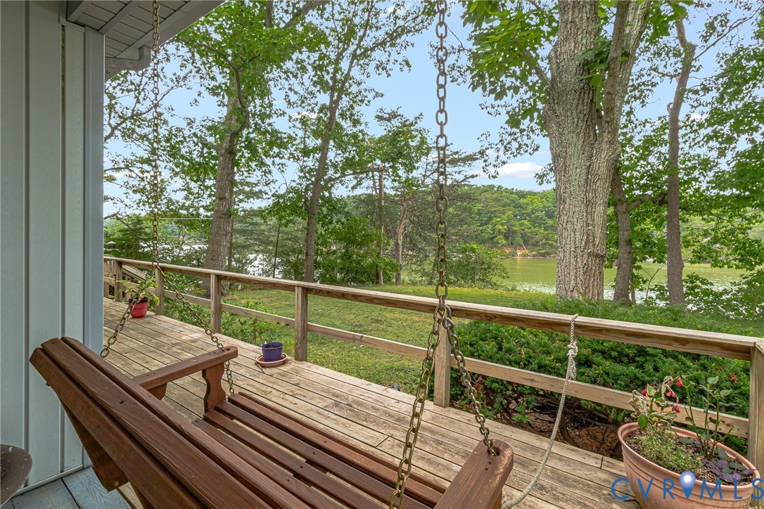 142 Bridge Lane Reedville, VA 22539 - Photo 48 of 56 a view of a balcony with wooden floor and fence
