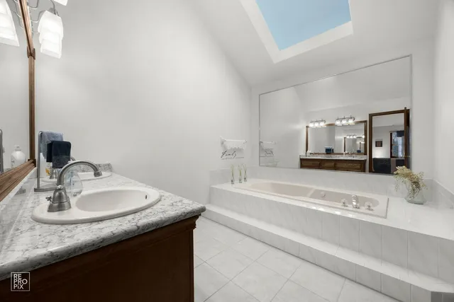 a view of a livingroom with a chandelier fan