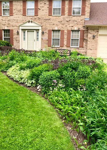 a view of a chairs and table in the balcony