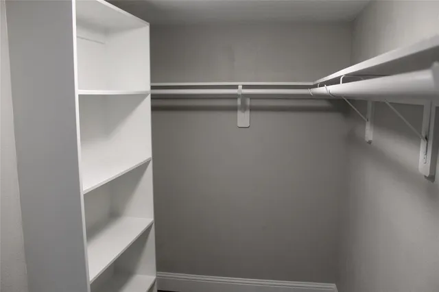 a view of an empty walk in closet