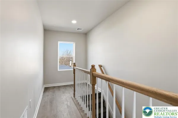 a view of a hallway with a window