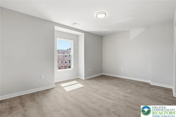 an empty room with window