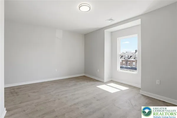 an empty room with windows