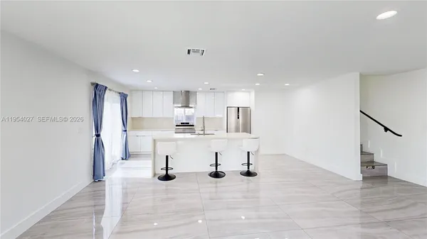 a view of kitchen with wooden floor