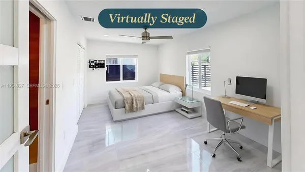 a bedroom with a bed and flat screen tv