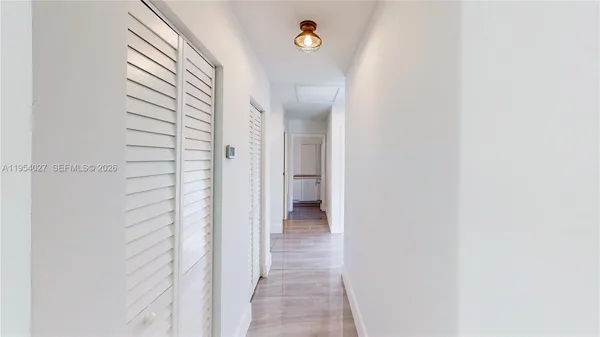 a view of a bathroom from a hallway