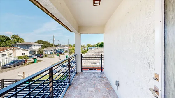 a view of a balcony with an outdoor space
