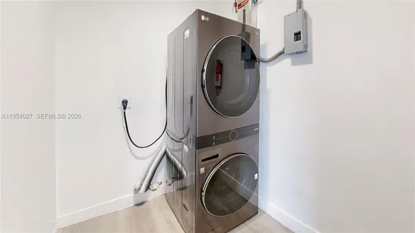 a utility room with dryer and washer