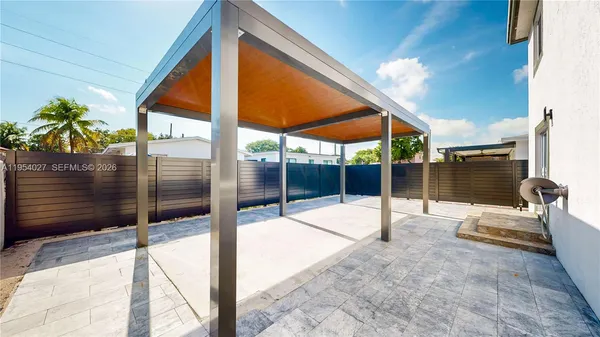 a view of swimming pool with a patio