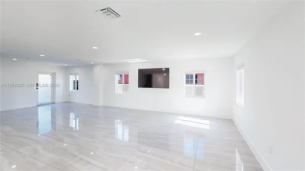 a view of a projector room with a ceiling fan