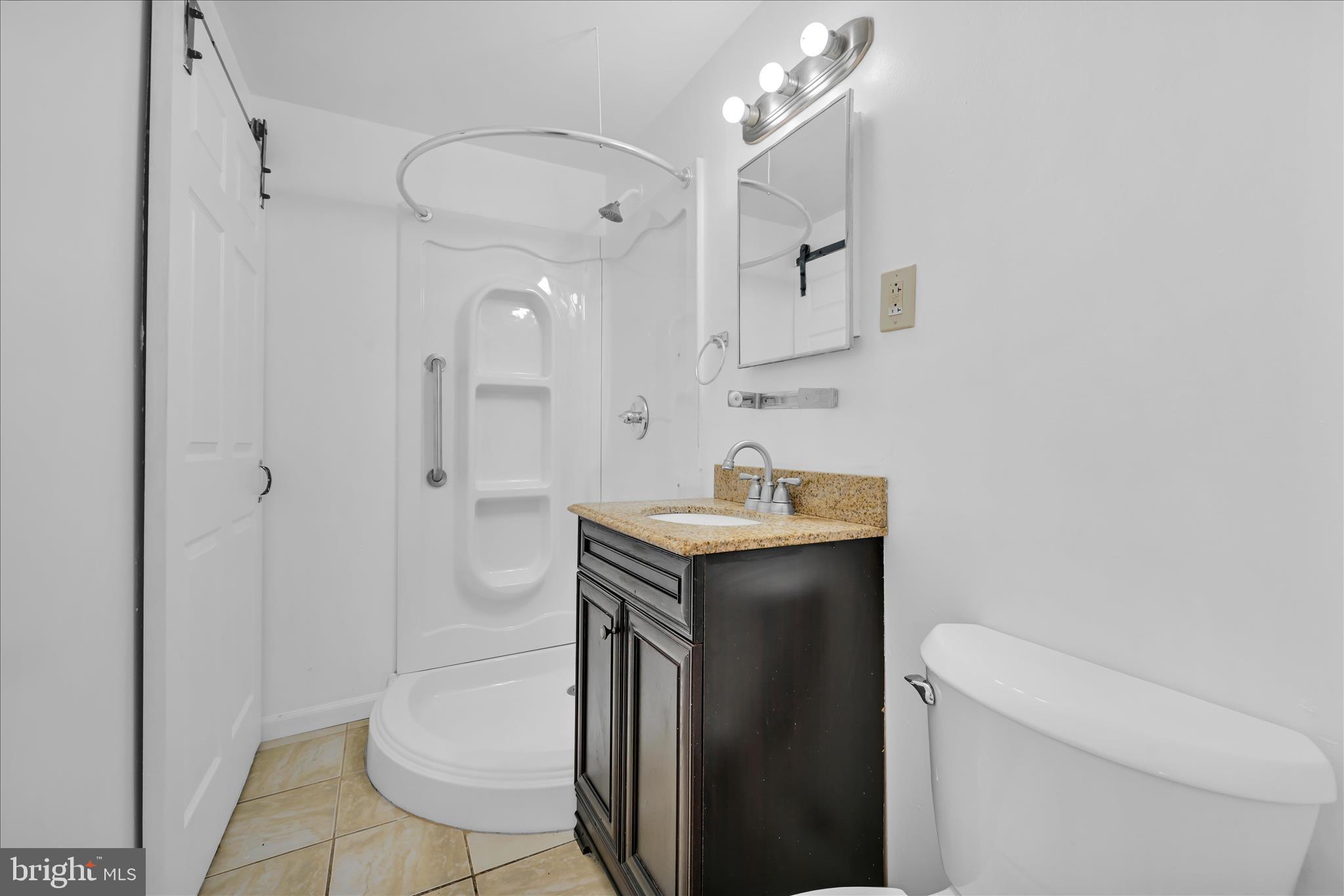 9001 Ridge Avenue, Unit 46 Philadelphia, PA 19128 - Photo 15 of 29 1st floor bath