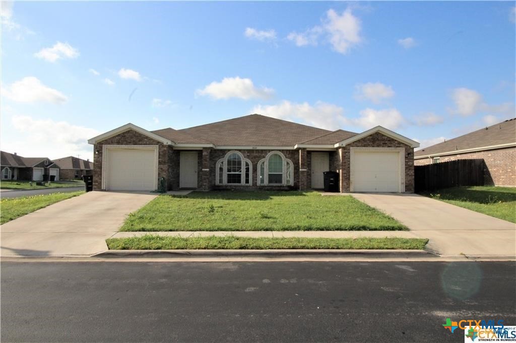 front view of a house with a yard