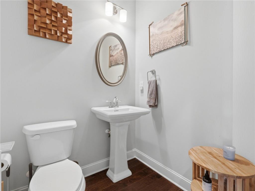 147 Fieldbrook Crossing Canton, GA 30115 - Photo 16 of 46 a bathroom with a toilet a sink and a mirror