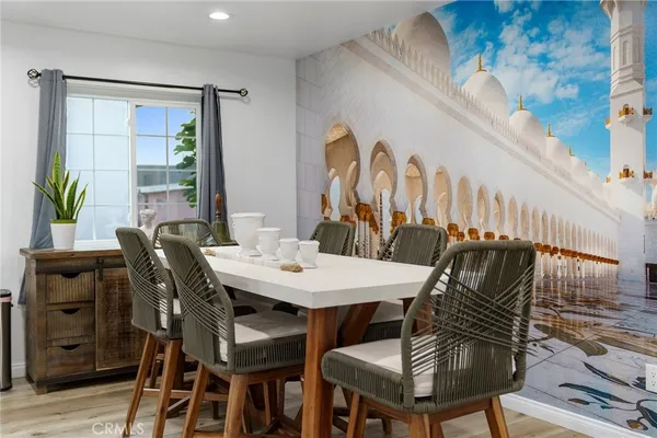 a view of a dining room with furniture and wooden floor