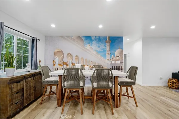 a view of a dining room with furniture window and outside view