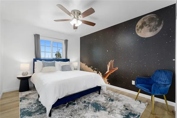 a bedroom with a bed and a window