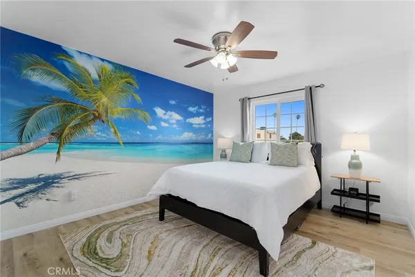 a large bed sitting in a bedroom next to a bathroom