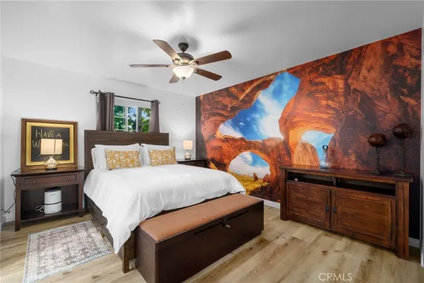 a bedroom with a bed and window