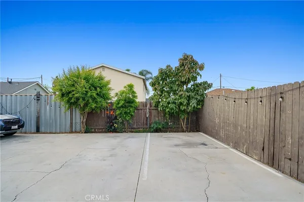 an aerial view of a house with outdoor space
