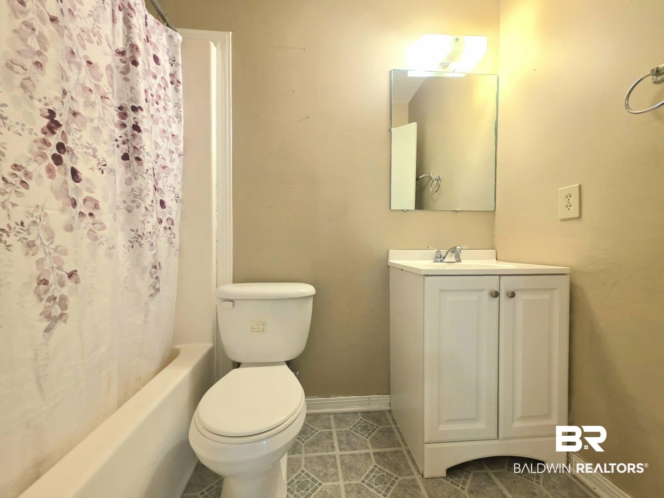 11 Coal Fire Road Jackson, AL 36545 - Photo 23 of 23 Bathroom featuring vanity, light tile patterned floors, and shower / tub combo with curtain
