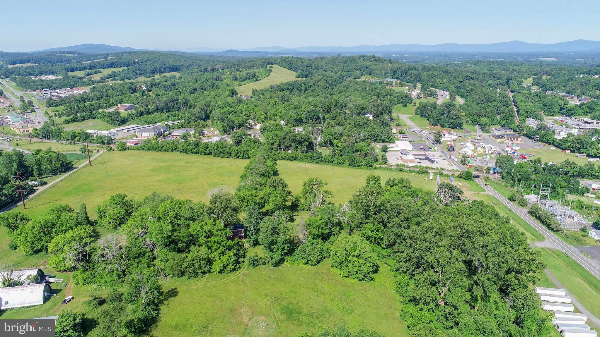 12261 Old Gordonsville Road Orange, VA 22960 - Photo 16 of 24 a view of a lush green field with lots of bushes