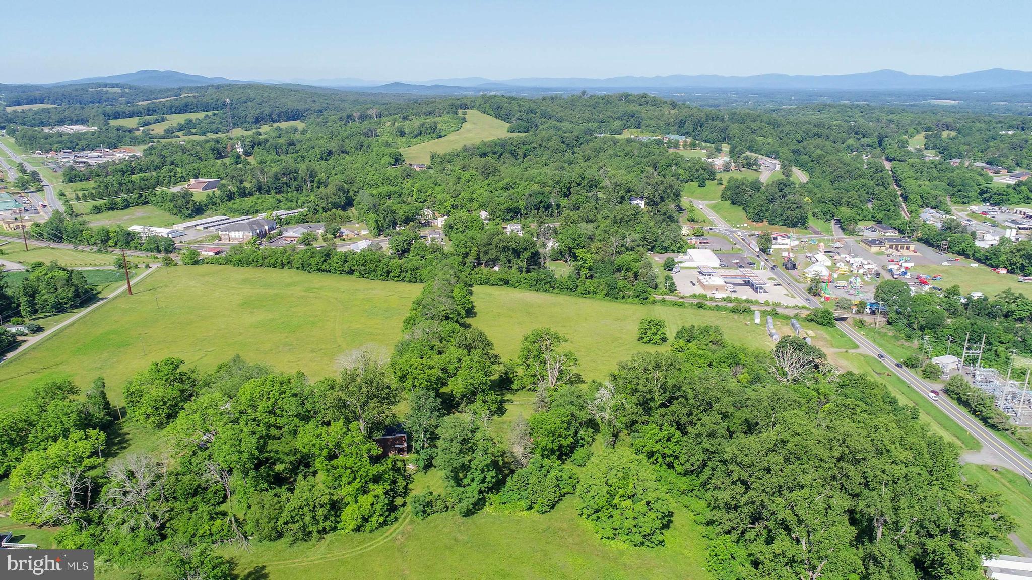 12261 Old Gordonsville Road Orange, VA 22960 - Photo 17 of 24 an aerial view of residential houses with outdoor space and trees