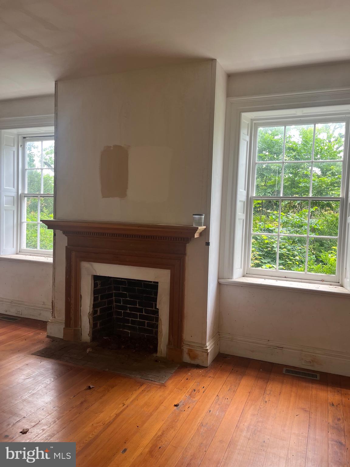 12261 Old Gordonsville Road Orange, VA 22960 - Photo 18 of 24 a view of an empty room with wooden floor and a window