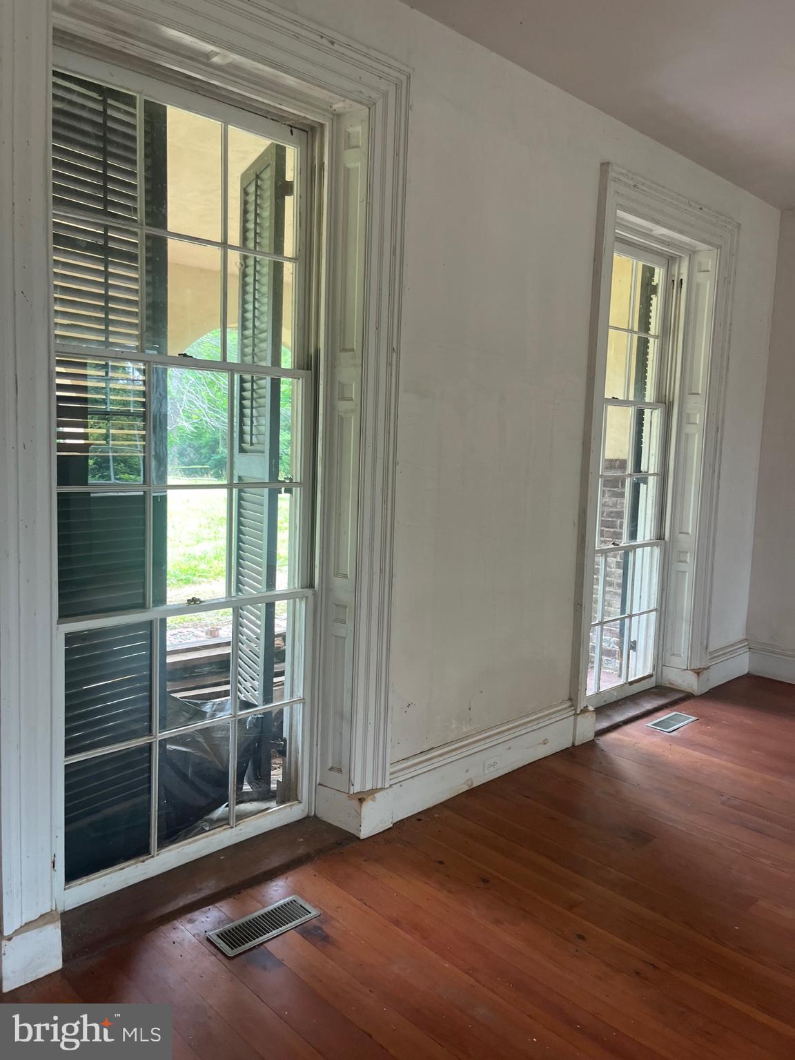 12261 Old Gordonsville Road Orange, VA 22960 - Photo 23 of 24 an empty room with wooden floor and windows
