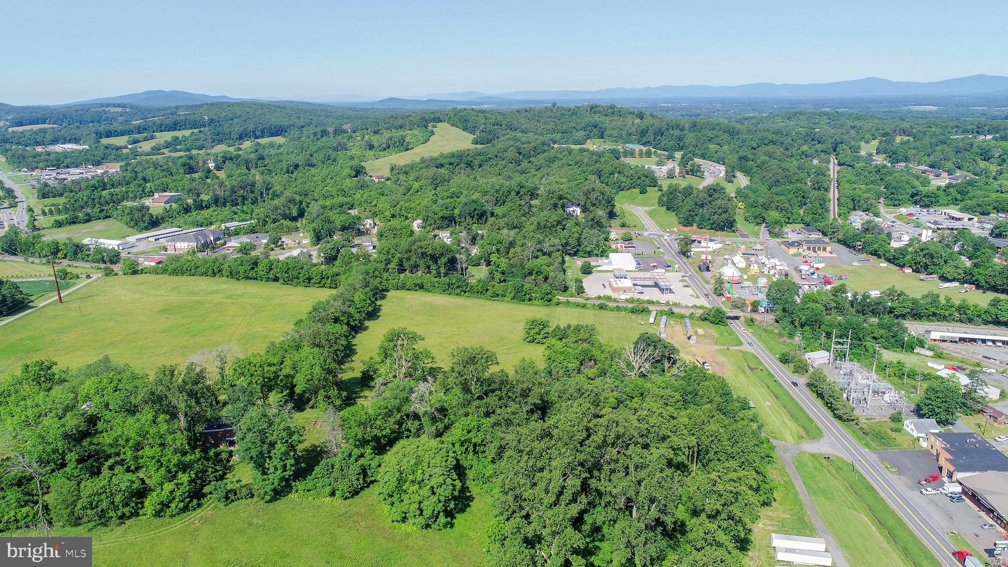 12261 Old Gordonsville Road Orange, VA 22960 - Photo 6 of 24 a view of a lush green outdoor space with a lake view