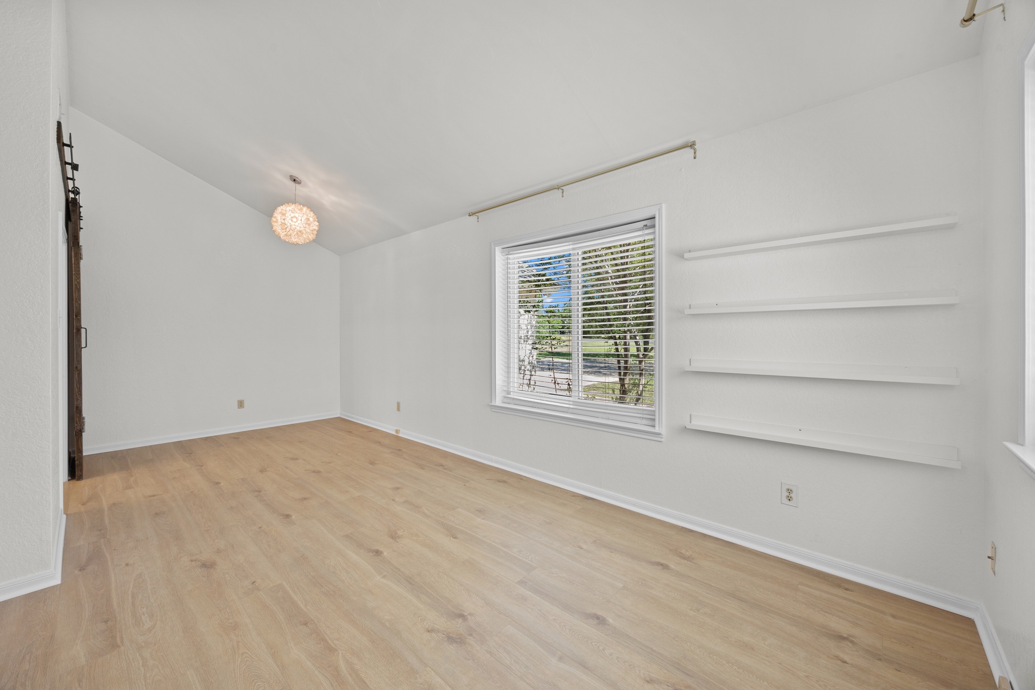 11019 Southwest Oaks Austin, TX 78737 - Photo 6 of 39 A large window floors natural light inside.