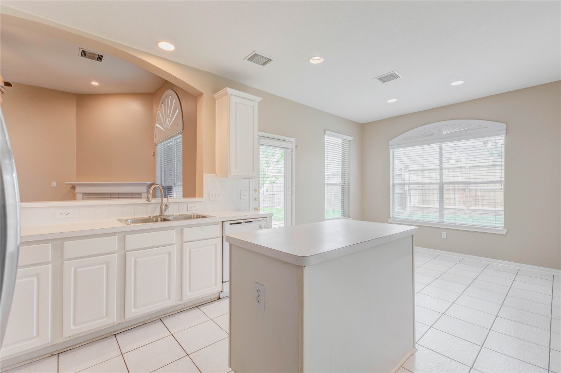 19607 Water Point Trail Humble, TX 77346 - Photo 15 of 32 Seamless open-concept flow between kitchen, dining, and living spaces.