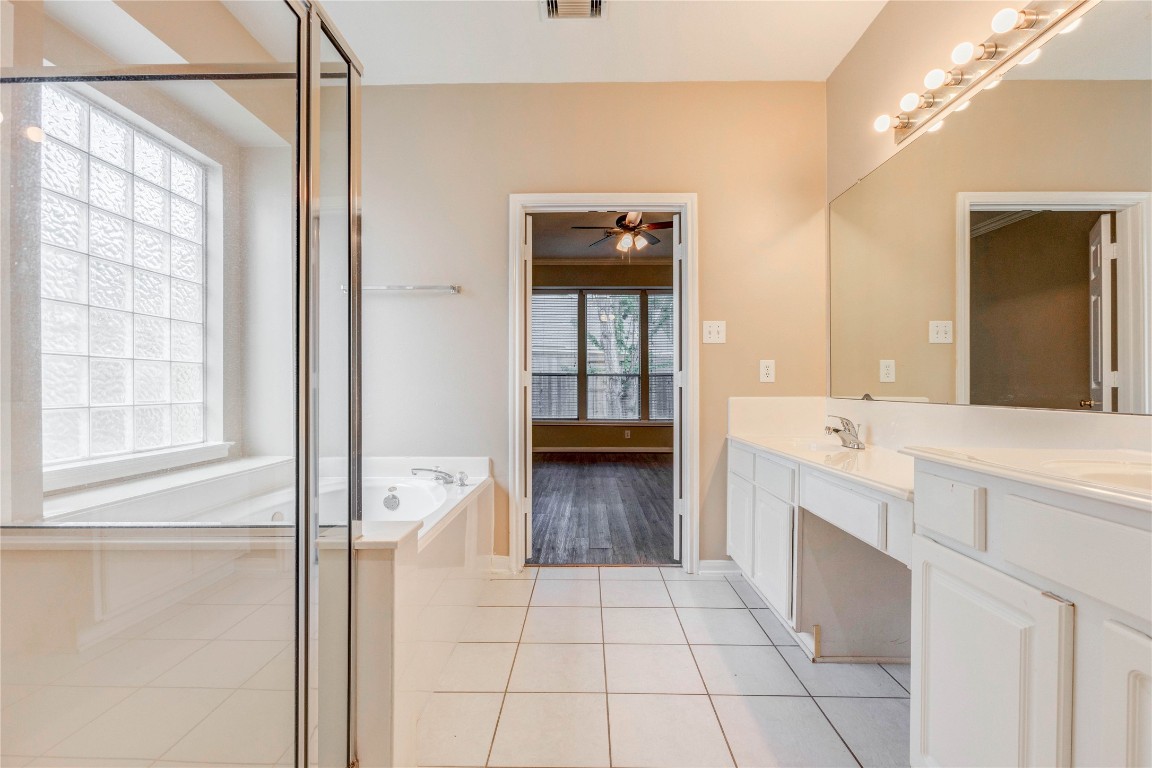 19607 Water Point Trail Humble, TX 77346 - Photo 21 of 32 Spacious primary bath with dual vanities, separate shower, and soaking tub