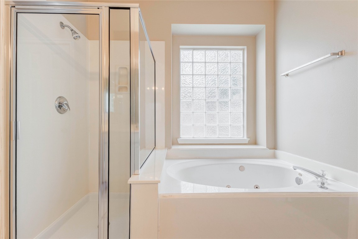 19607 Water Point Trail Humble, TX 77346 - Photo 22 of 32 Relaxing soaking tub with glass block window and separate walk-in shower.