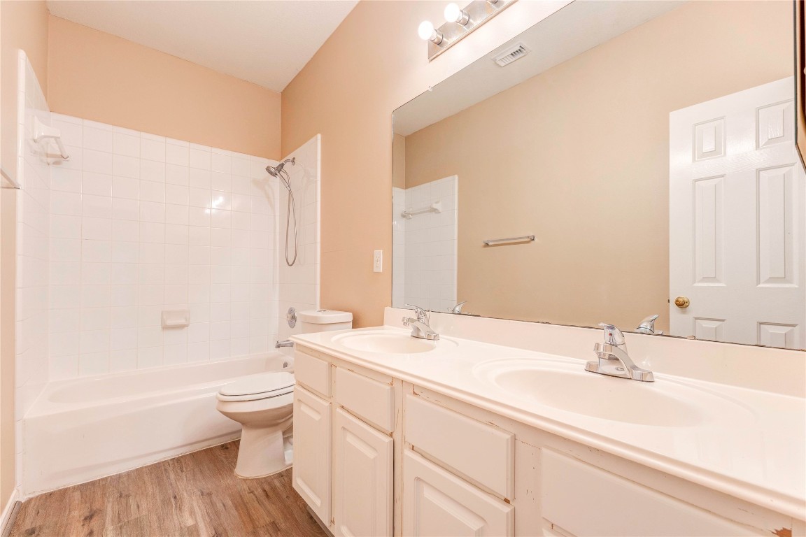 19607 Water Point Trail Humble, TX 77346 - Photo 28 of 32 Spacious bathroom featuring dual sinks, large mirror, and tub/shower combo.