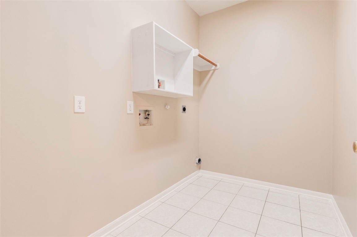 19607 Water Point Trail Humble, TX 77346 - Photo 29 of 32 Dedicated laundry room with shelving and space for full-size washer and dryer.