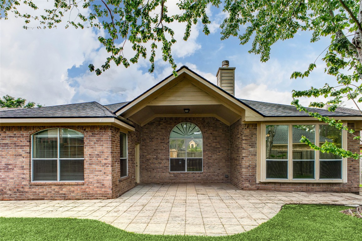 19607 Water Point Trail Humble, TX 77346 - Photo 30 of 32 Covered patio area, perfect for outdoor dining and gatherings.
